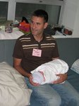 Held by his uncle. Taken on August 21st, 2007