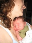 Happy and sleepy after getting fed, resting in Betsy's arms. Taken on August 27th, 2007